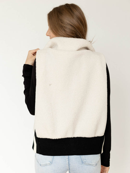 white and black sherpa vest