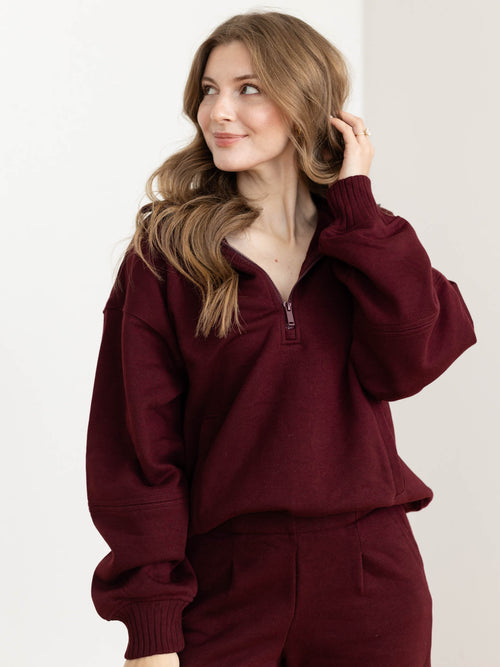 dark wine colored half zip sweatshirt