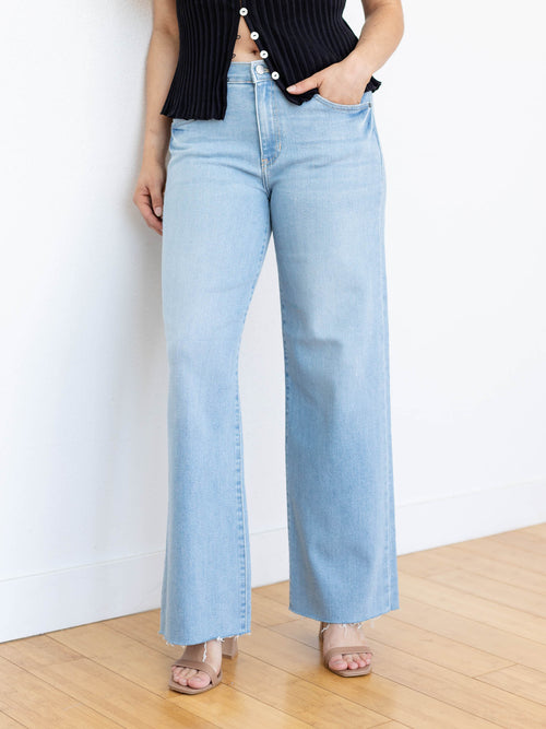 light wash wide leg raw hem denim