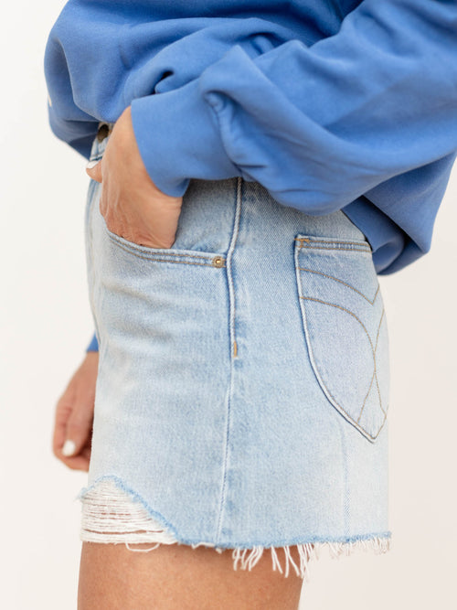 light blue distressed denim shorts