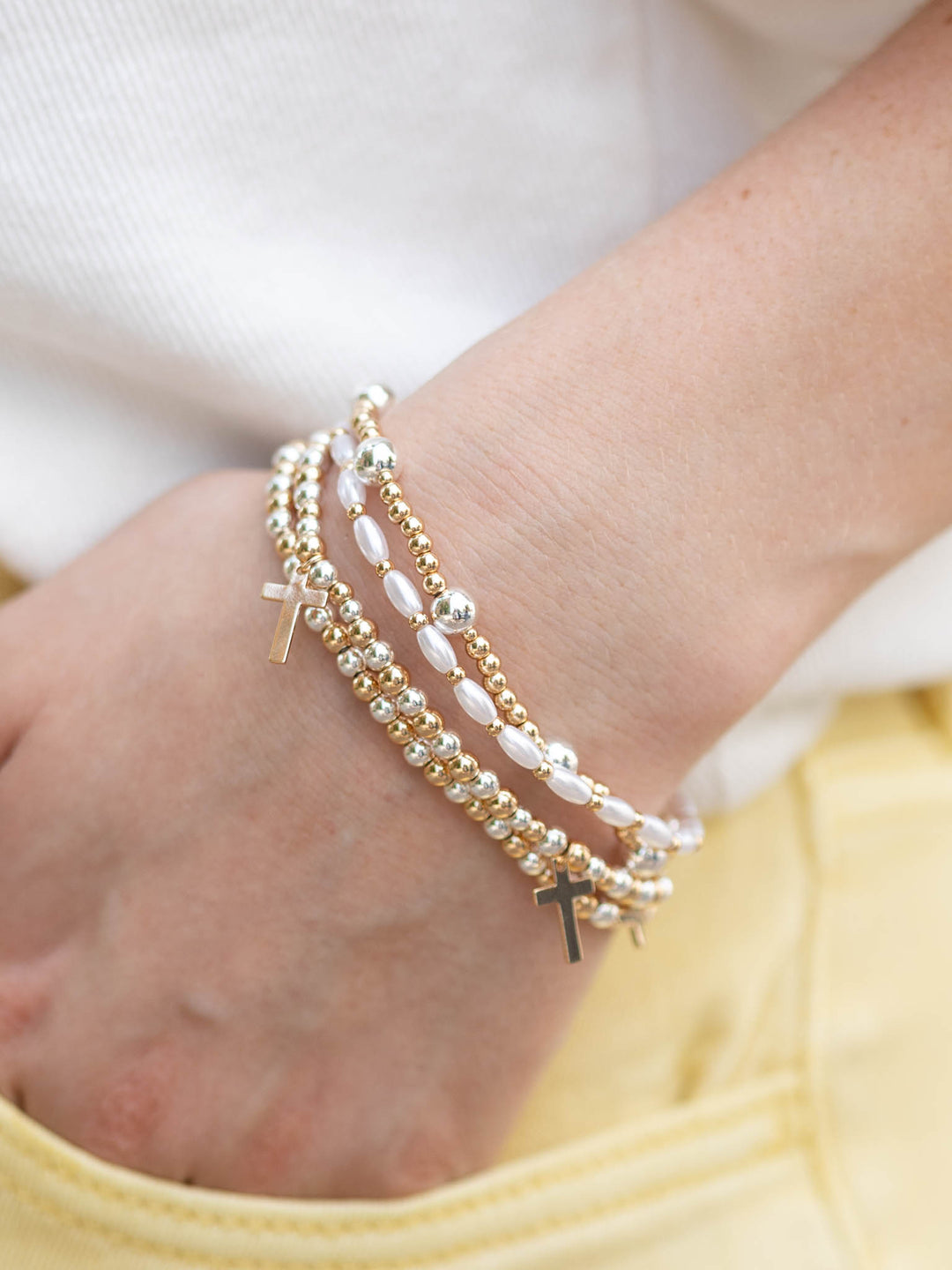 Gold and silver pearl and cross charm beaded bracelets