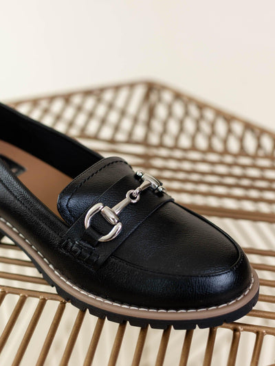 black loafer with silver buckle