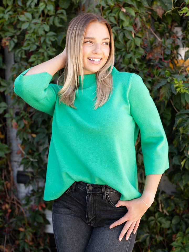 green mock neck sweater