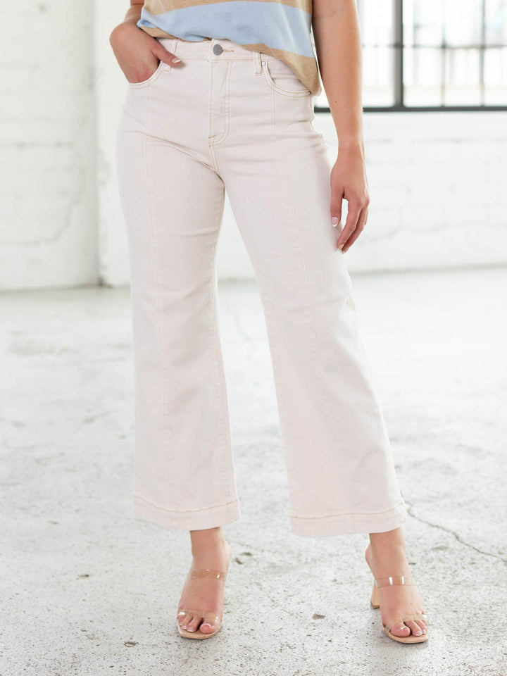 RISEN Ivory High Rise Crop Wide Pants with front seam detail, worn with clear heels.