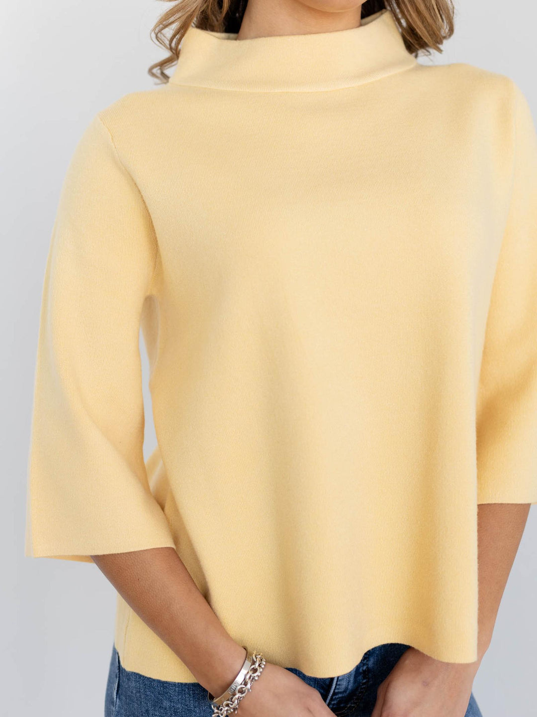 yellow mock neck sweater