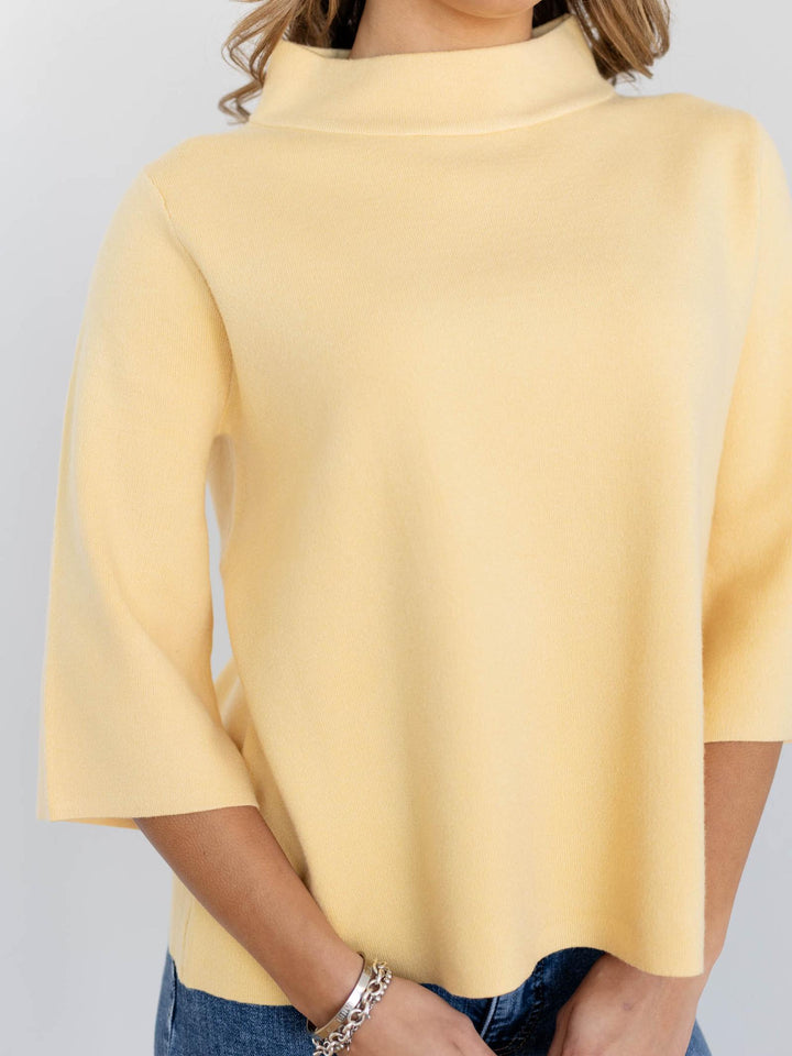 yellow mock neck sweater