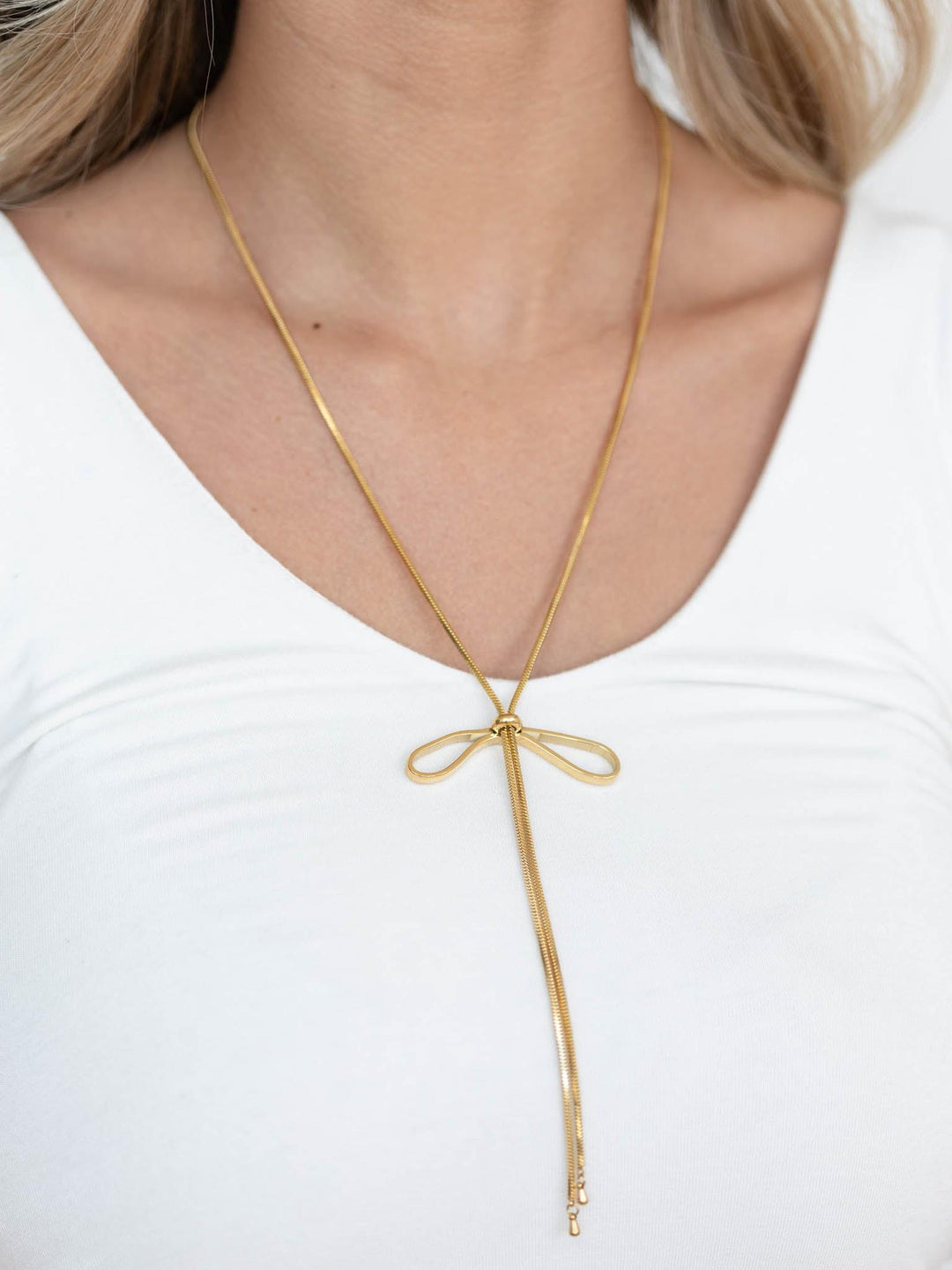 gold bow lariat necklace