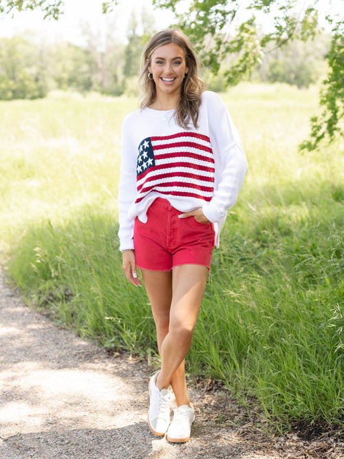 washed red raw hem shorts