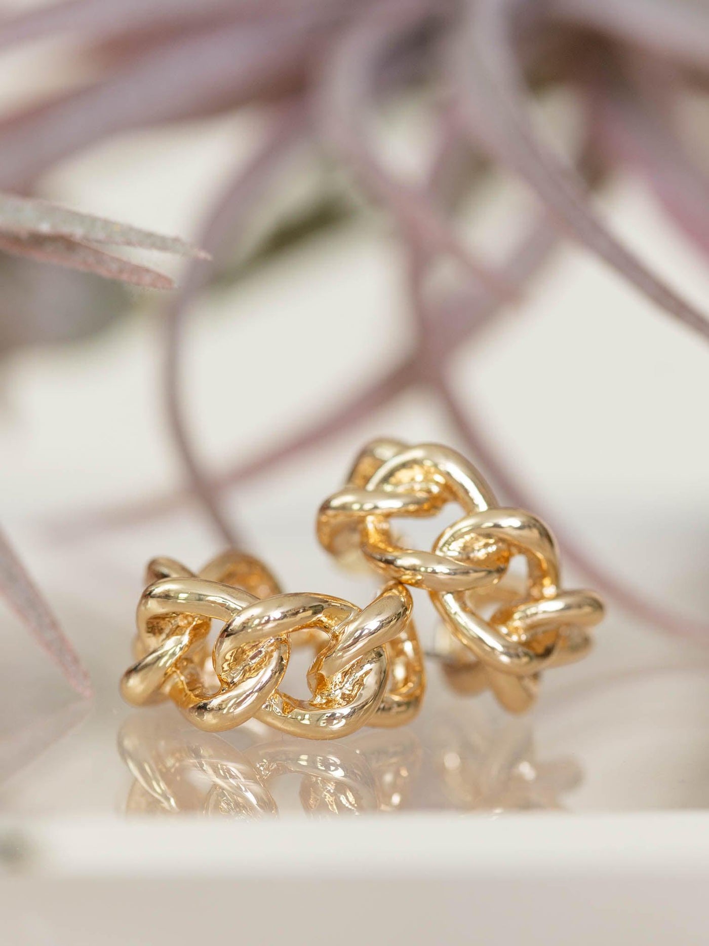 gold metal earrings