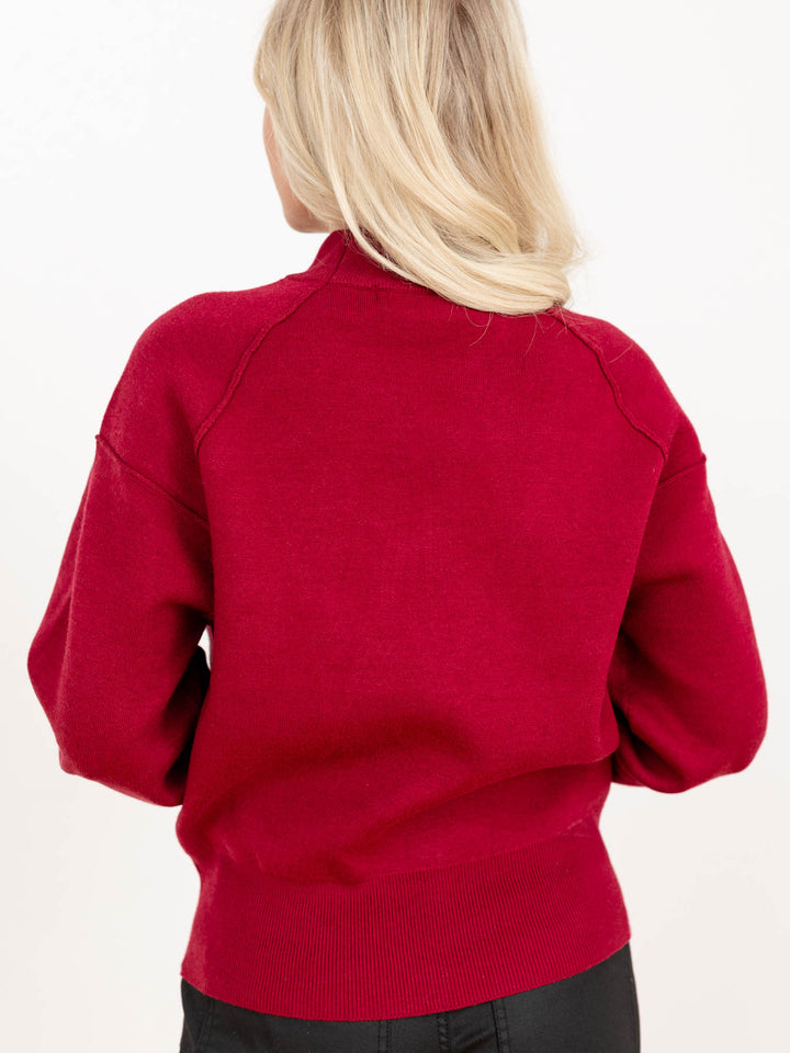 exposed seam mock neck raglan sweater