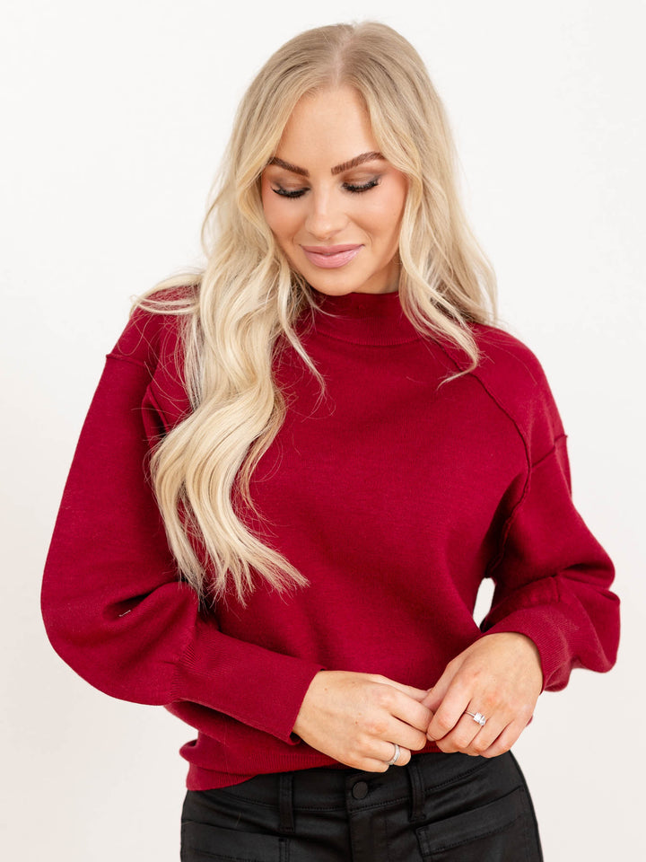 exposed seam mock neck raglan sweater