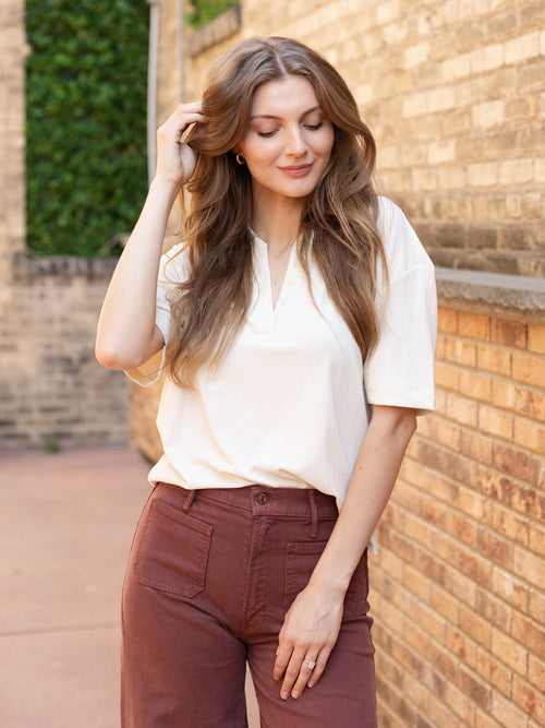 cream half button short sleeve top