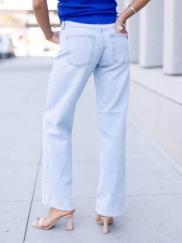 studded light wash denim jeans
