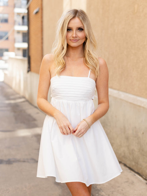 white bow back pleated mini dress