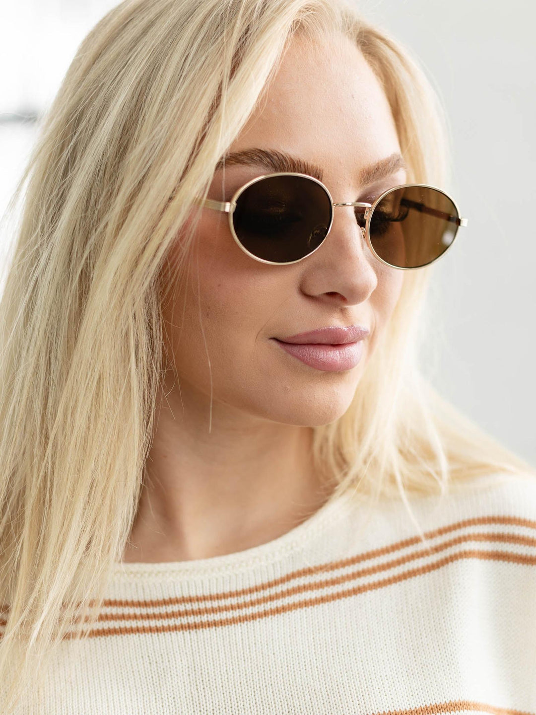 gold metal oval sunglasses