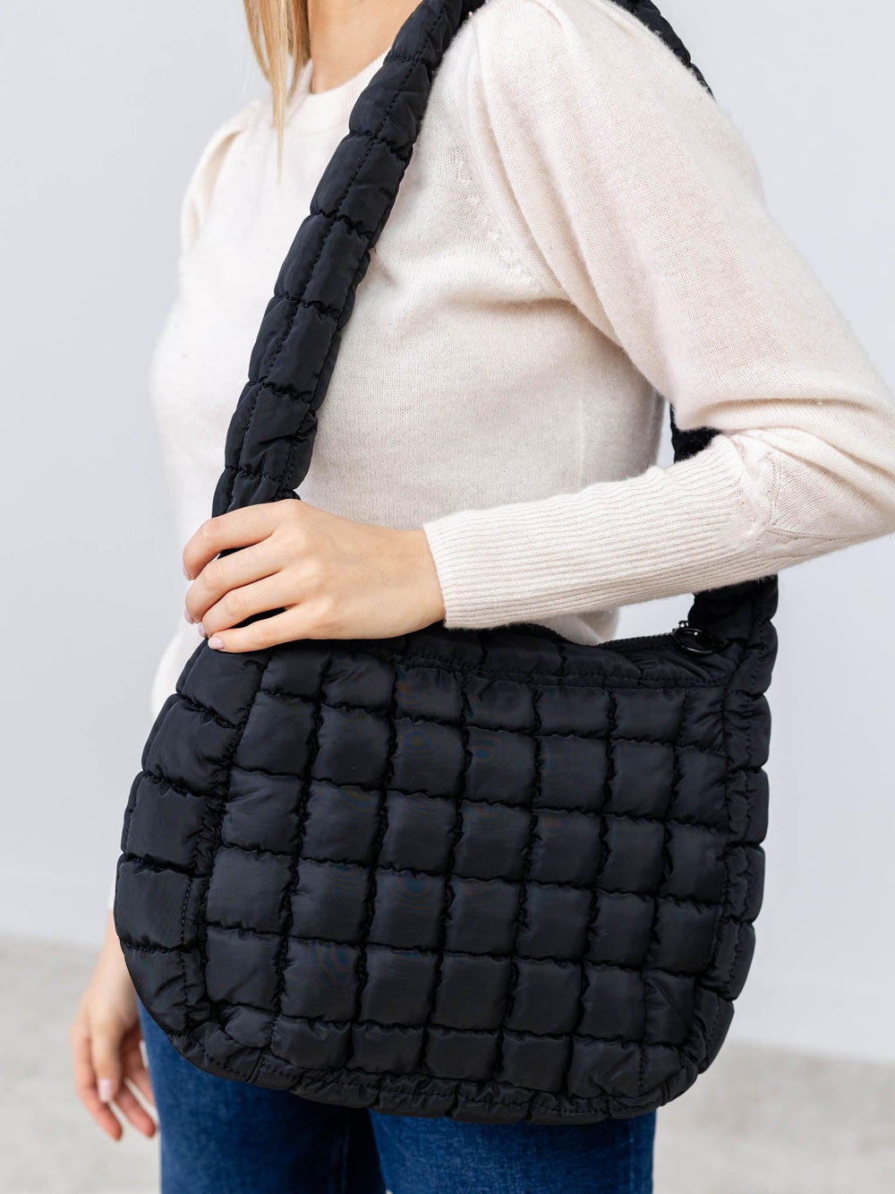 black puffy quilted bag