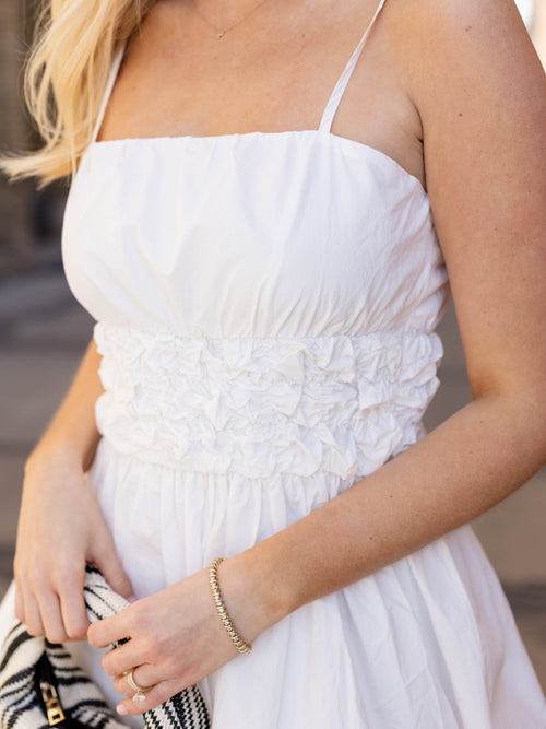 white smocked waist bubble mini dress