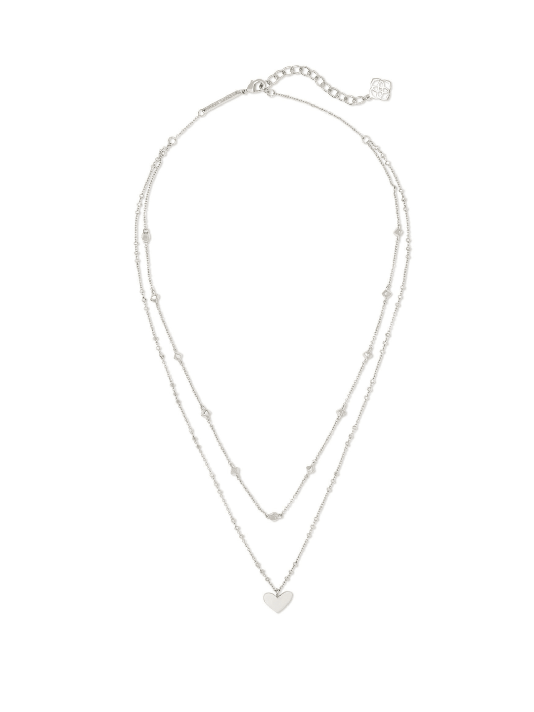 A delicate silver double-strand necklace with a small heart-shaped pendant, displayed on a clean white background.
