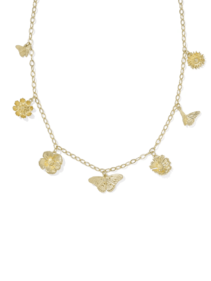 Gold necklace with butterfly and flower pendants on a white background