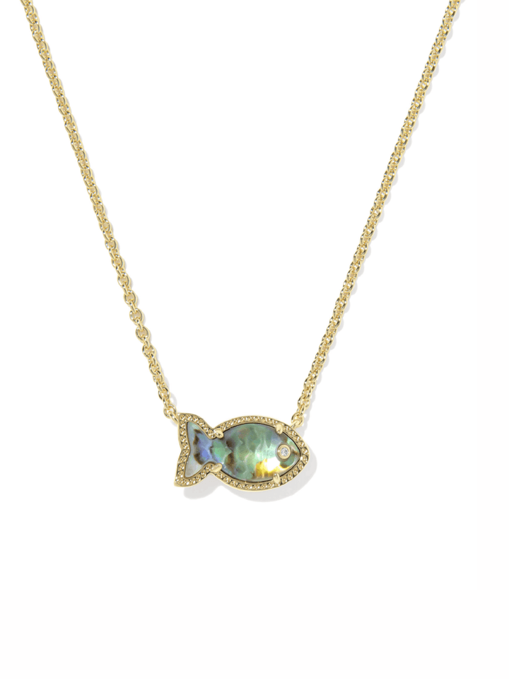 A gold chain necklace with a fish-shaped pendant featuring an iridescent green-blue mother-of-pearl center and small clear stones, shown on a plain white background.