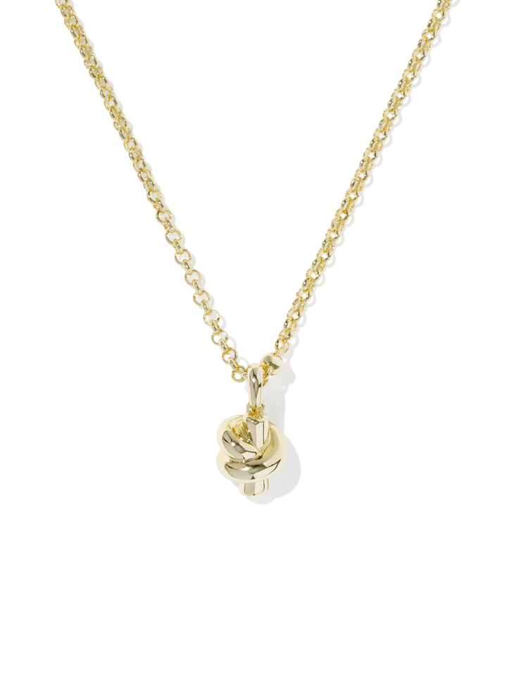 A delicate gold chain necklace featuring a small, polished gold knot pendant, displayed against a clean white background with a soft shadow.