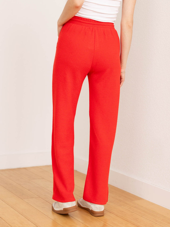 red textured straight leg pant