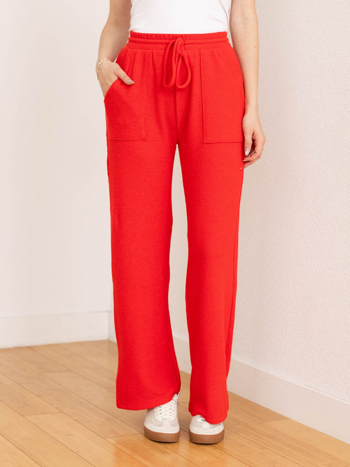 red textured straight leg pant