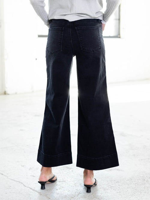 flared black denim jeans