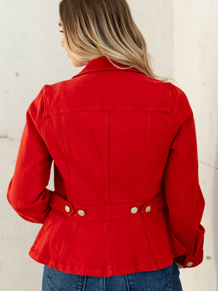 Person wearing a red jacket with a white background