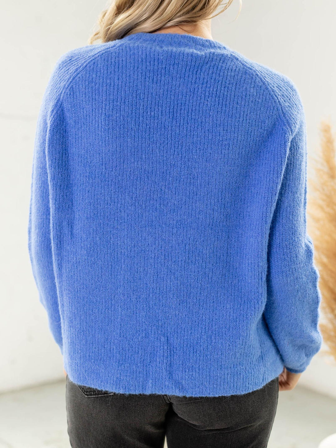 bright blue fuzzy crew neck sweater