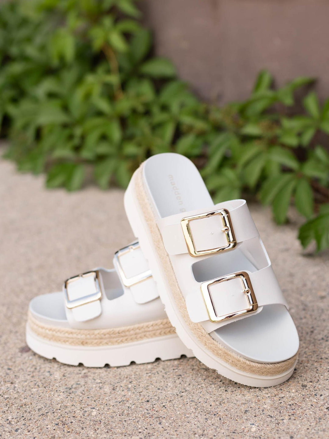 White Madden Girl Mythical 2 Buckle Flatbed Sandals with gold buckles and espadrille trim.
