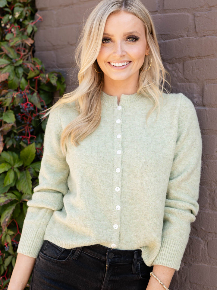 green button front sweater