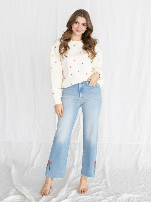 lightwash ankle denim with embroidered red bow