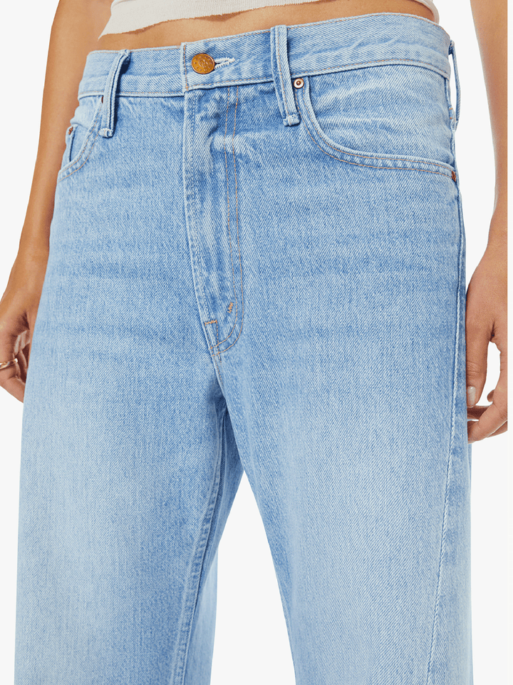Light blue jeans with a brand logo on a white background