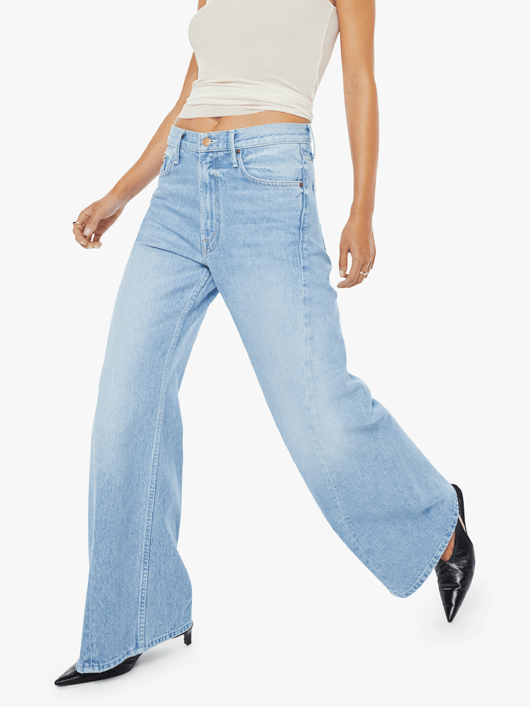 Light blue jeans worn by a person on a white background