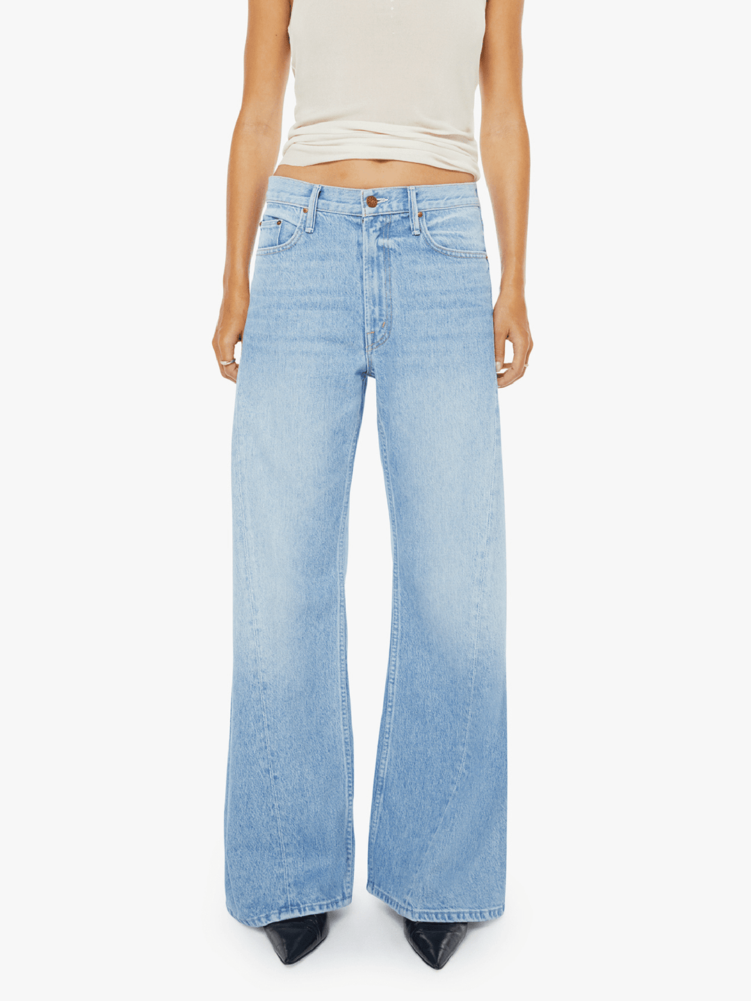 Light blue jeans worn by a person on a white background