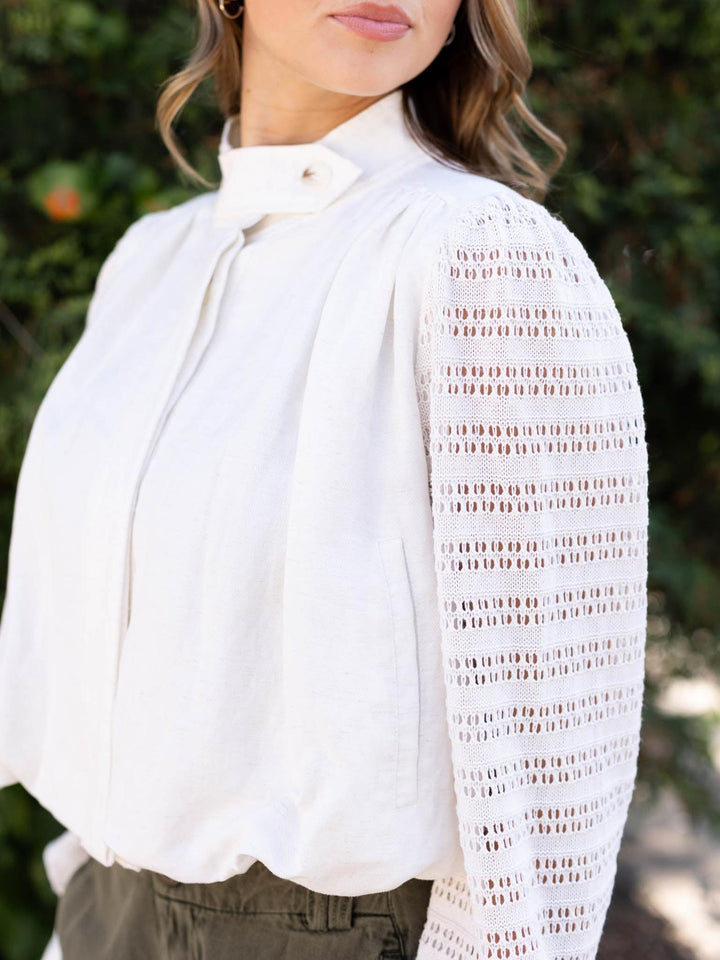 Off White Mystree Bubble Hem Jacket with unique crochet knit sleeves and button front closure.