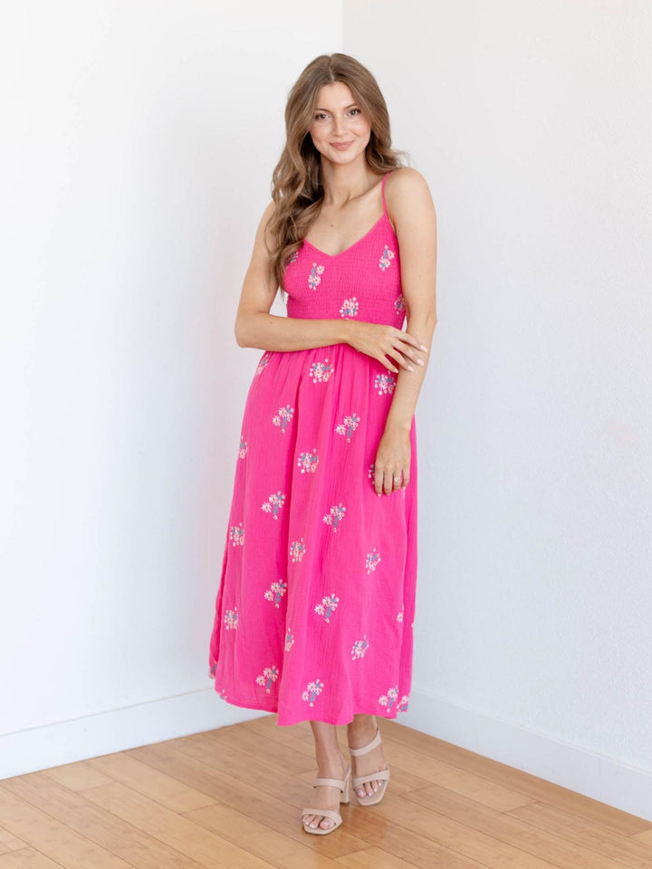 bold pink smocked floral midi dress