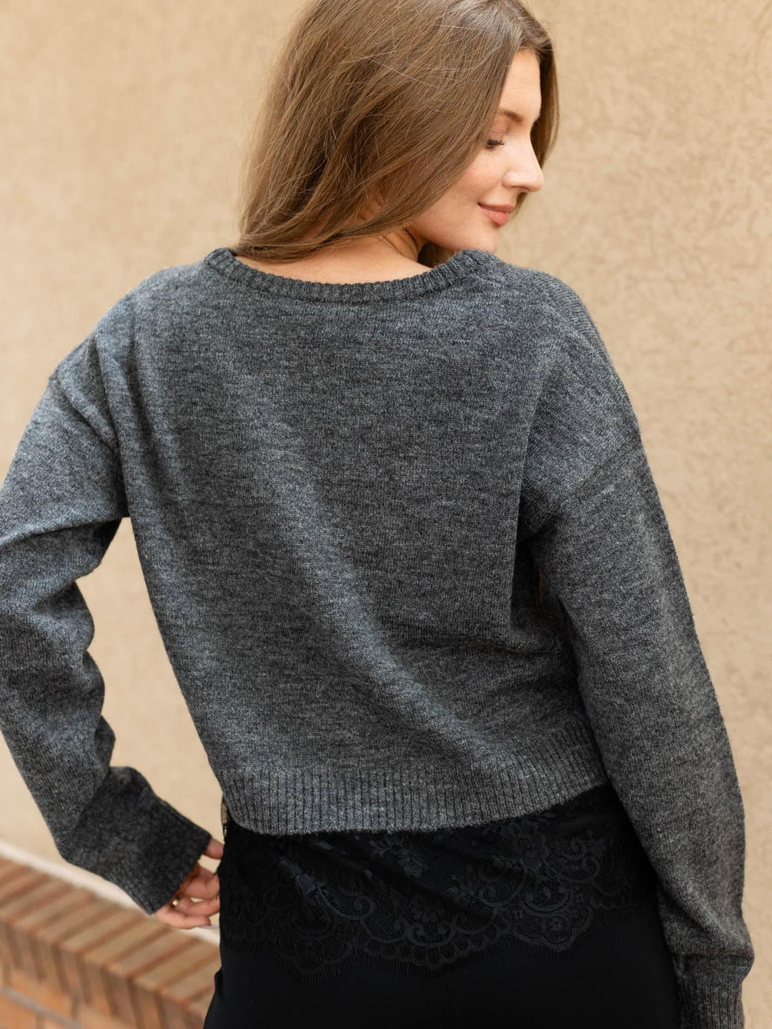 sweater layered over lace