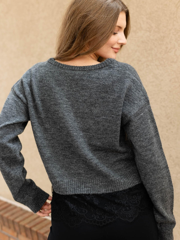 sweater layered over lace