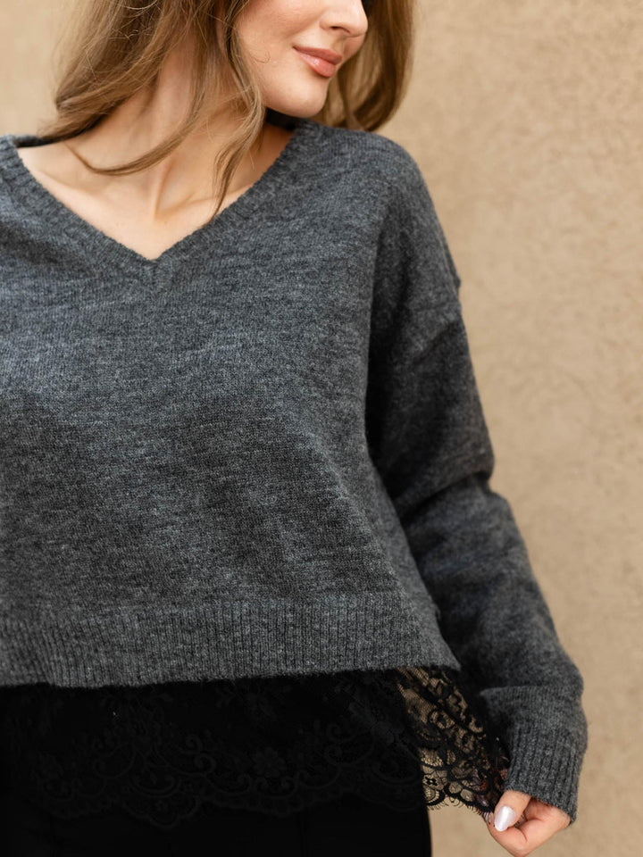 sweater layered over lace