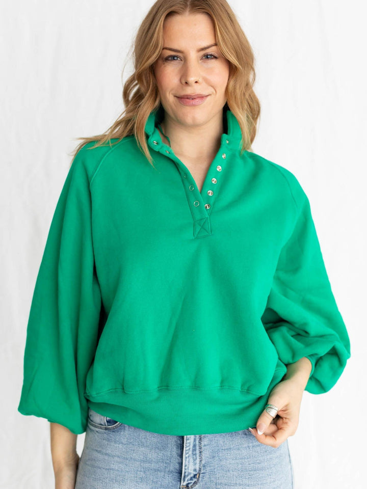 green half button pullover with puff sleeves