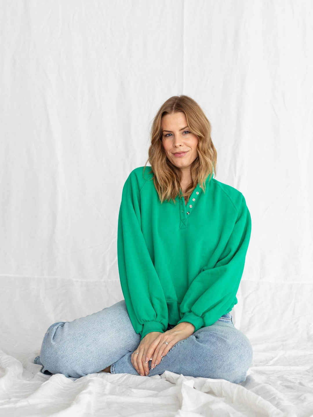 green half button pullover with puff sleeves