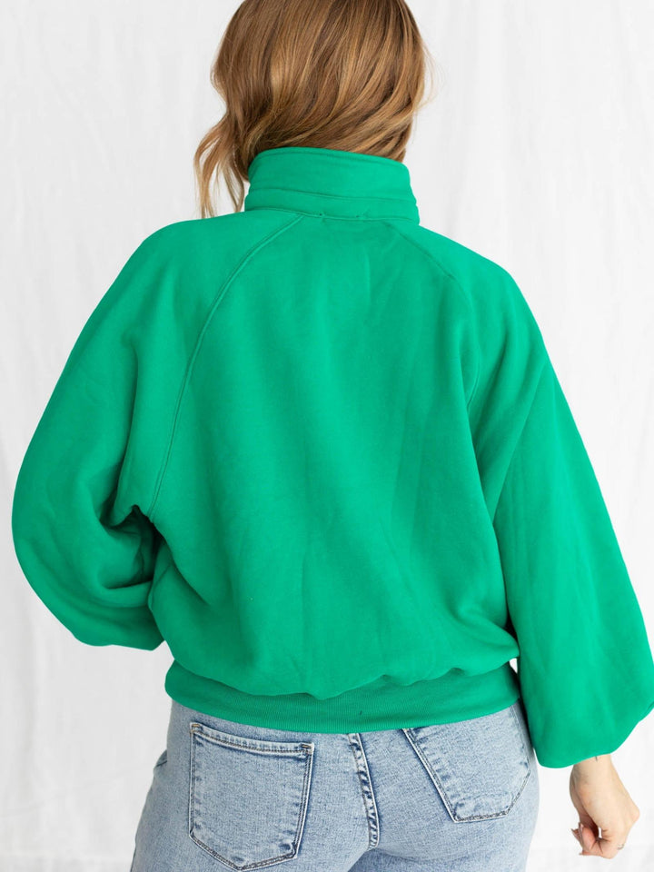 green half button pullover with puff sleeves