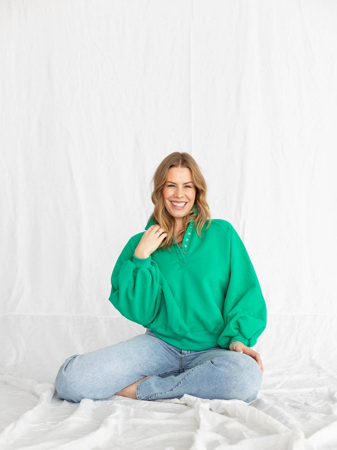 green half button pullover with puff sleeves