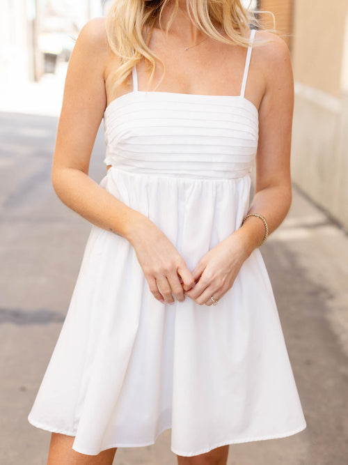 white bow back pleated mini dress