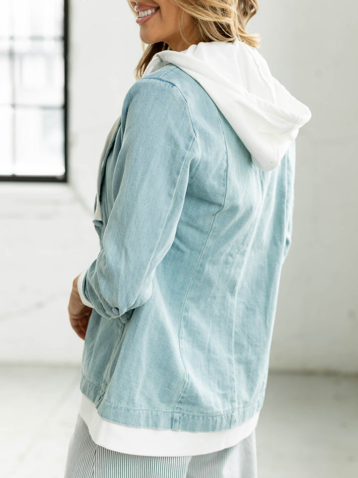 layered hoody under light wash denim blazer