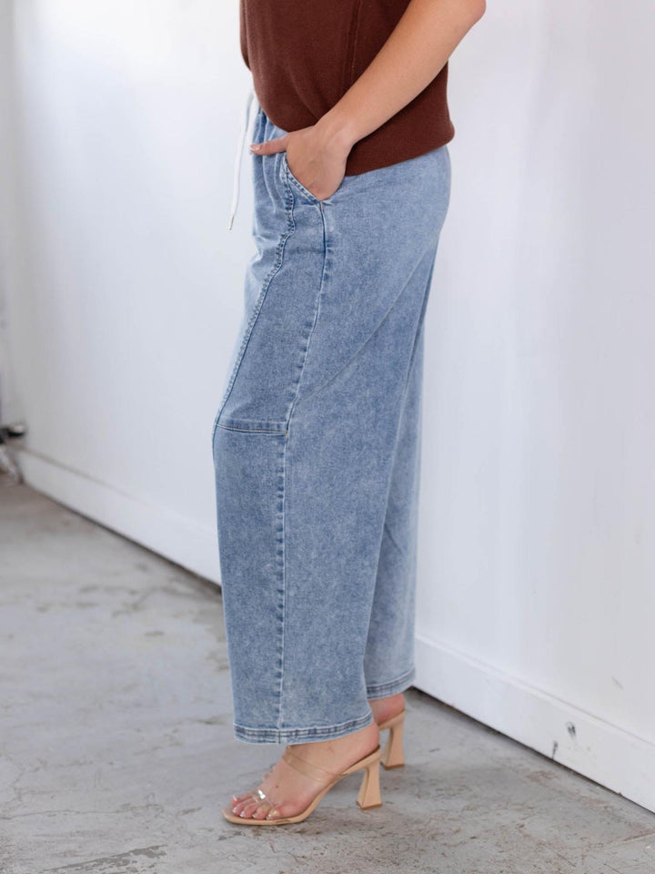 RISEN light wash slouchy crop barrel seam detail jeans with elastic waist.