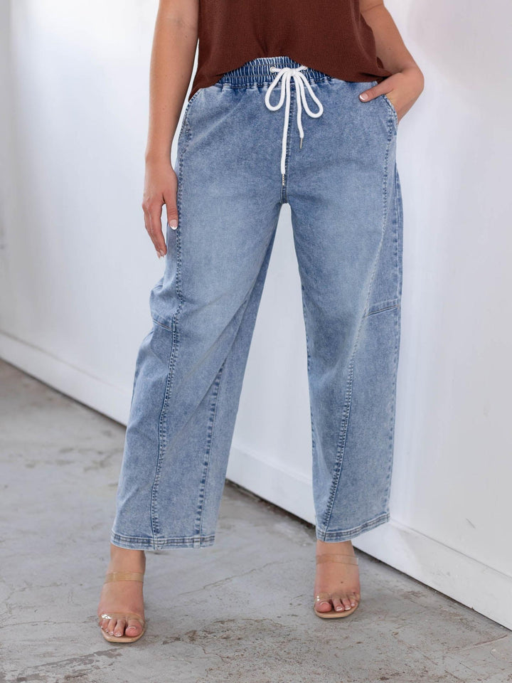 RISEN light wash slouchy crop barrel jeans with white drawstring and seam detail.