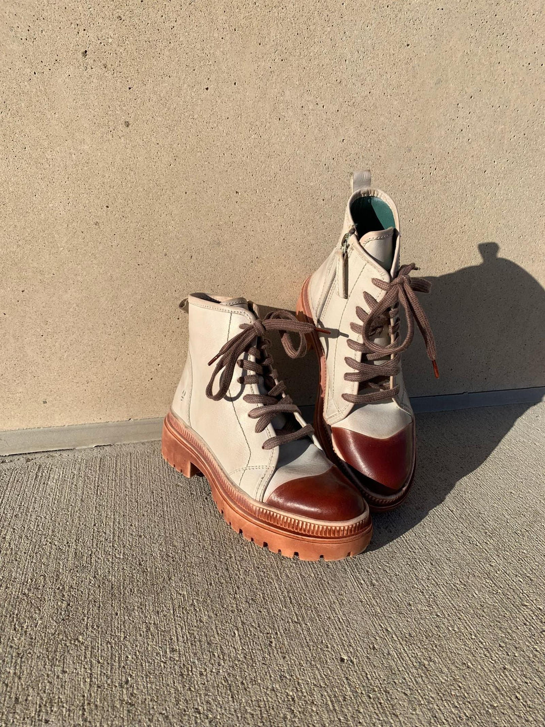 cream and brown lace up hiker boots